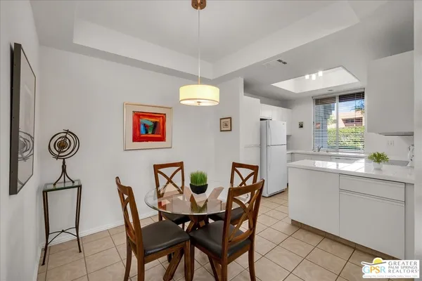 a view of a dining room with furniture and window