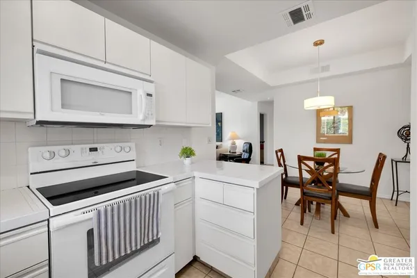 a kitchen that has a cabinets counter space and appliances