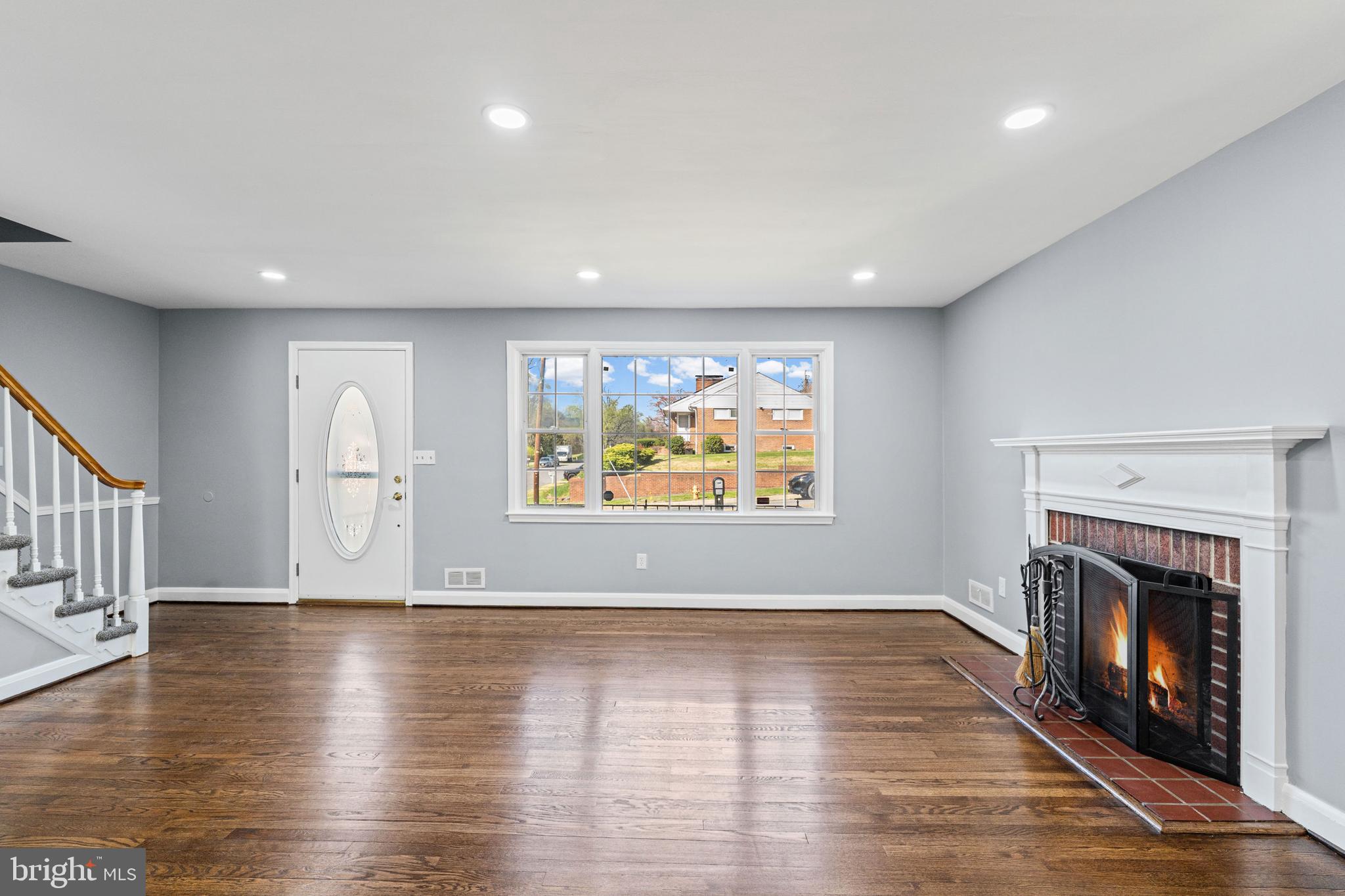 1413 Glendale Road Baltimore, MD 21239 - Photo 3 of 26 Living Room with Real Hardwood Floors & Fireplace