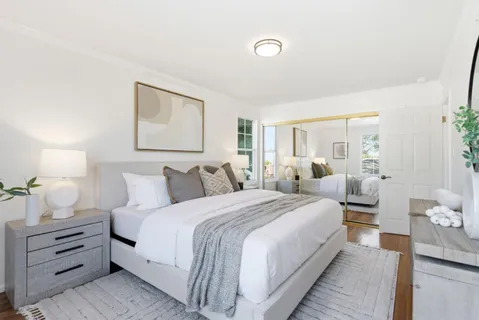 a bedroom with bed and window