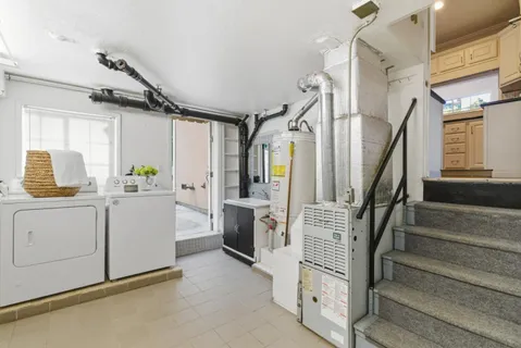 a view of entryway and hallway with wooden floor