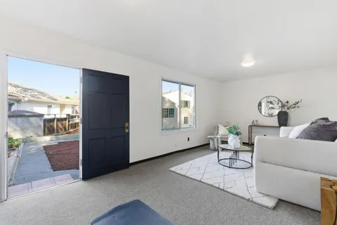 a view of kitchen with furniture and wooden floor