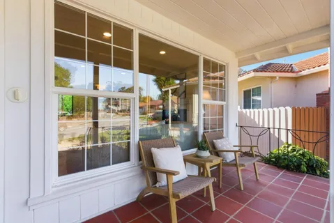 a balcony with furniture and city view