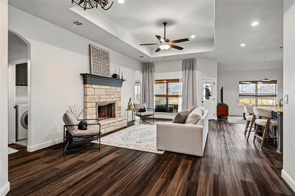 a living room with furniture and a fireplace