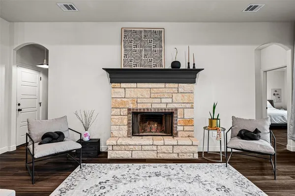 a living room with furniture and a fireplace
