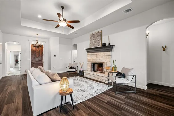 a living room with furniture and a fireplace