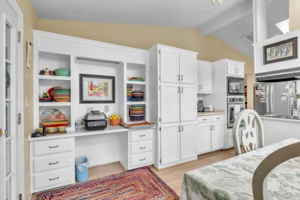 a bedroom with furniture and a closet