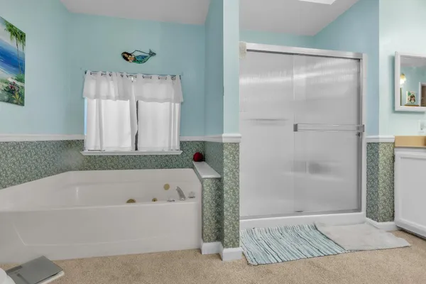 a bathroom with a bathtub and a shower