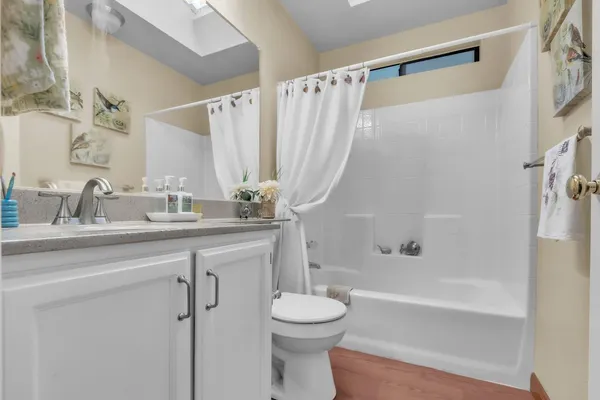 a bathroom with a sink a toilet and a bathtub