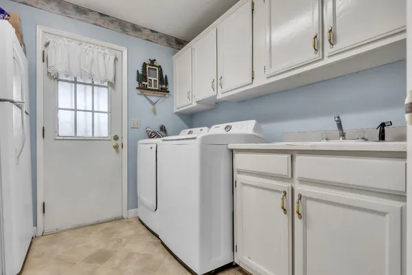 a view of cabinets and washer dryer