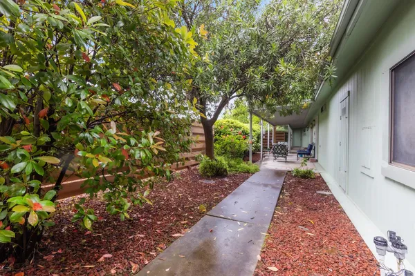 a view of a pathway with a patio