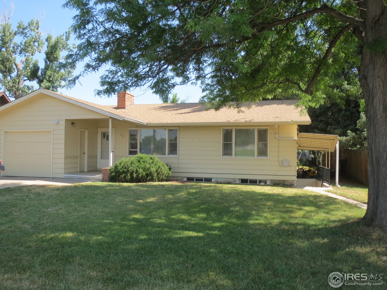 723 East Prospect Road Fort Collins, CO 80525 - Photo 1 of 18 a view of a house with a yard
