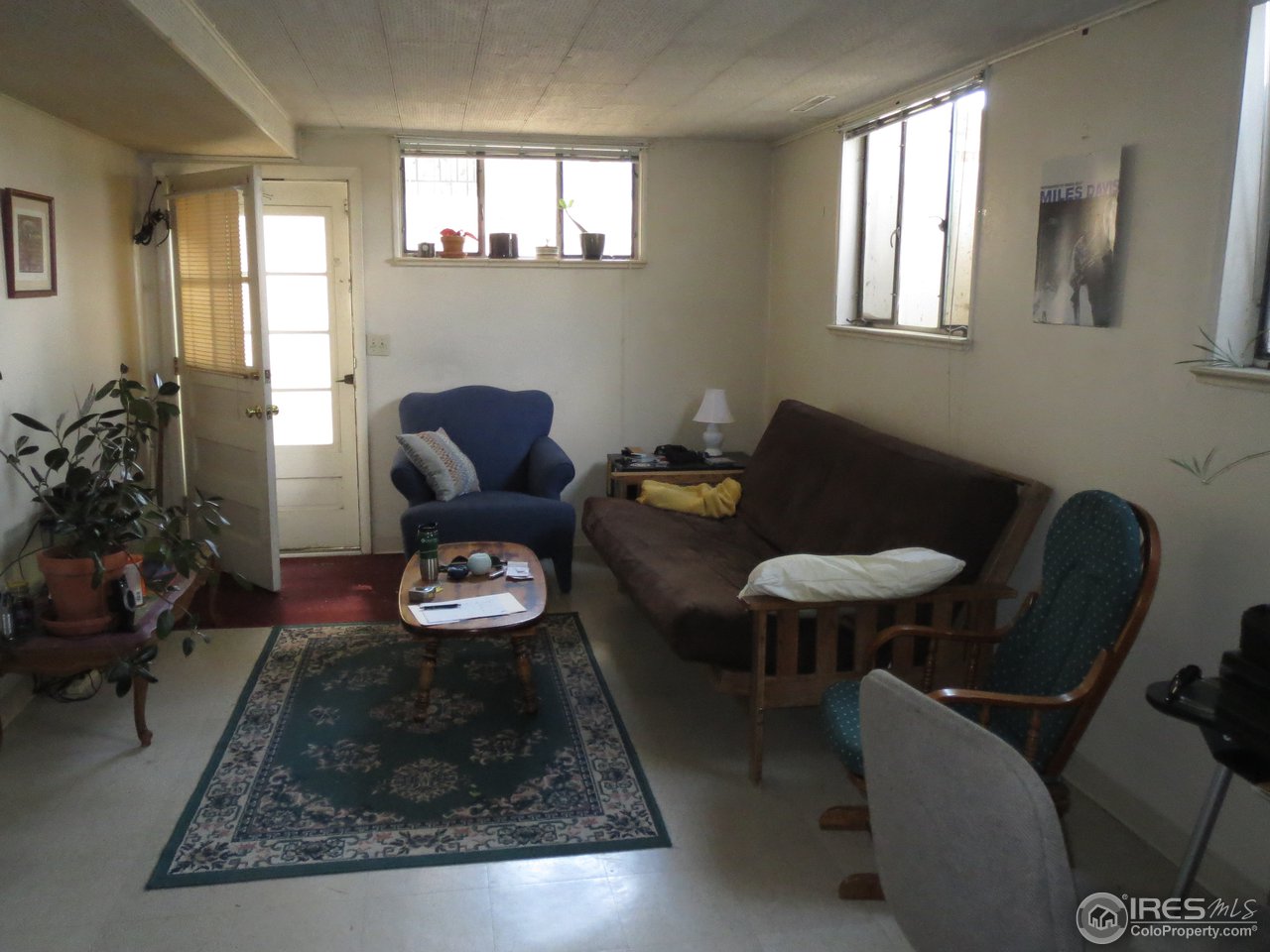 723 East Prospect Road Fort Collins, CO 80525 - Photo 12 of 18 a living room with furniture and a window