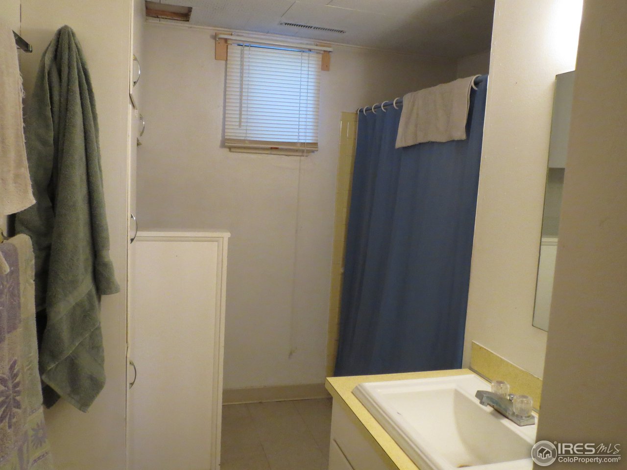 723 East Prospect Road Fort Collins, CO 80525 - Photo 14 of 18 a bathroom with a sink and a mirror