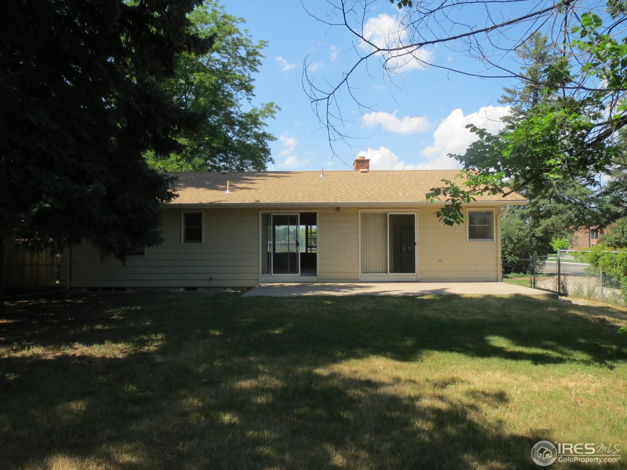 723 East Prospect Road Fort Collins, CO 80525 - Photo 17 of 18 a front view of a house with a garden