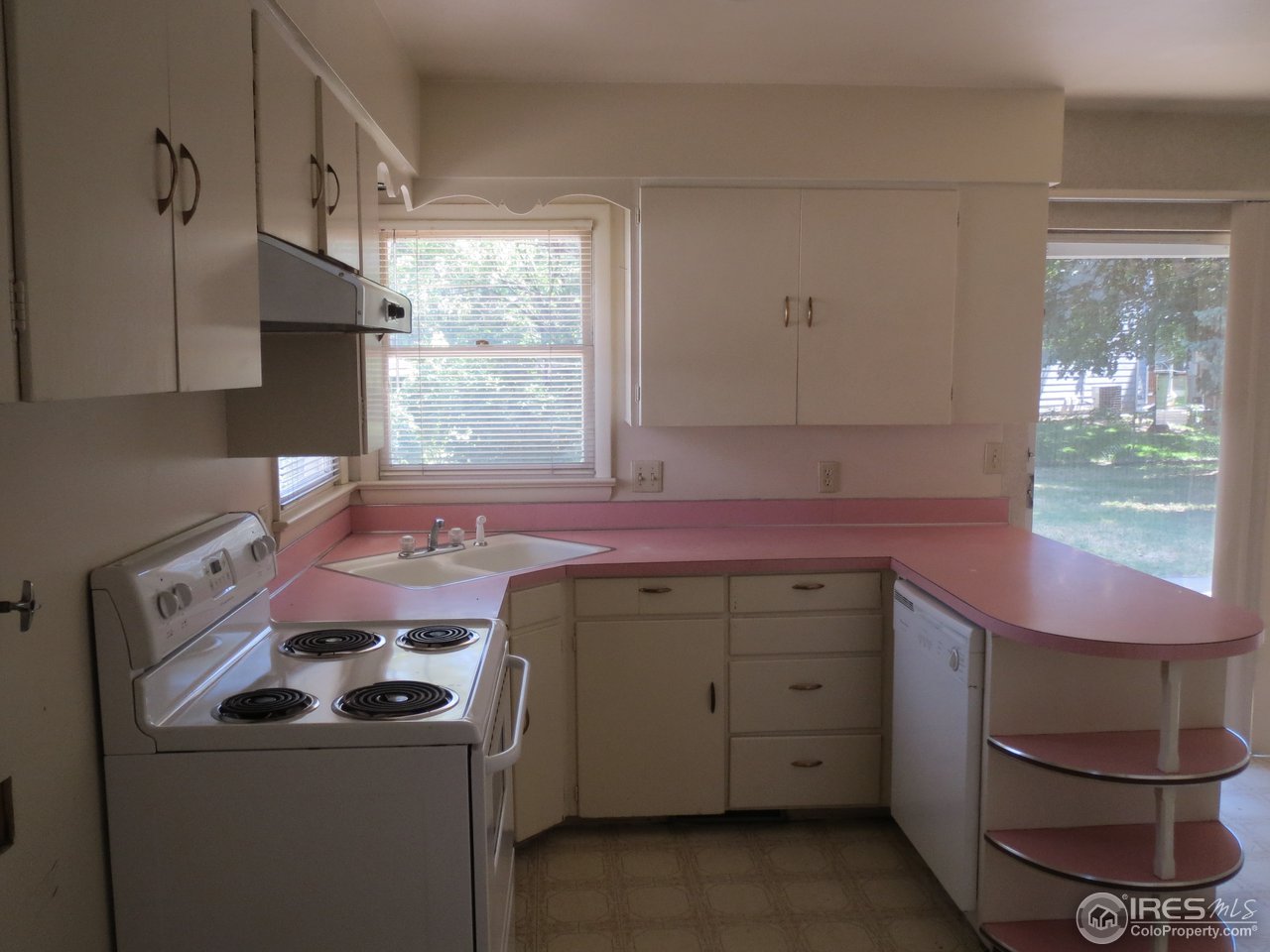 723 East Prospect Road Fort Collins, CO 80525 - Photo 4 of 18 a kitchen with a stove and a sink