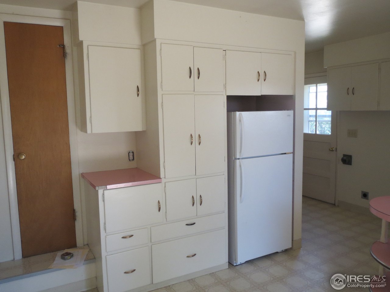 723 East Prospect Road Fort Collins, CO 80525 - Photo 5 of 18 a white refrigerator freezer sitting in a kitchen
