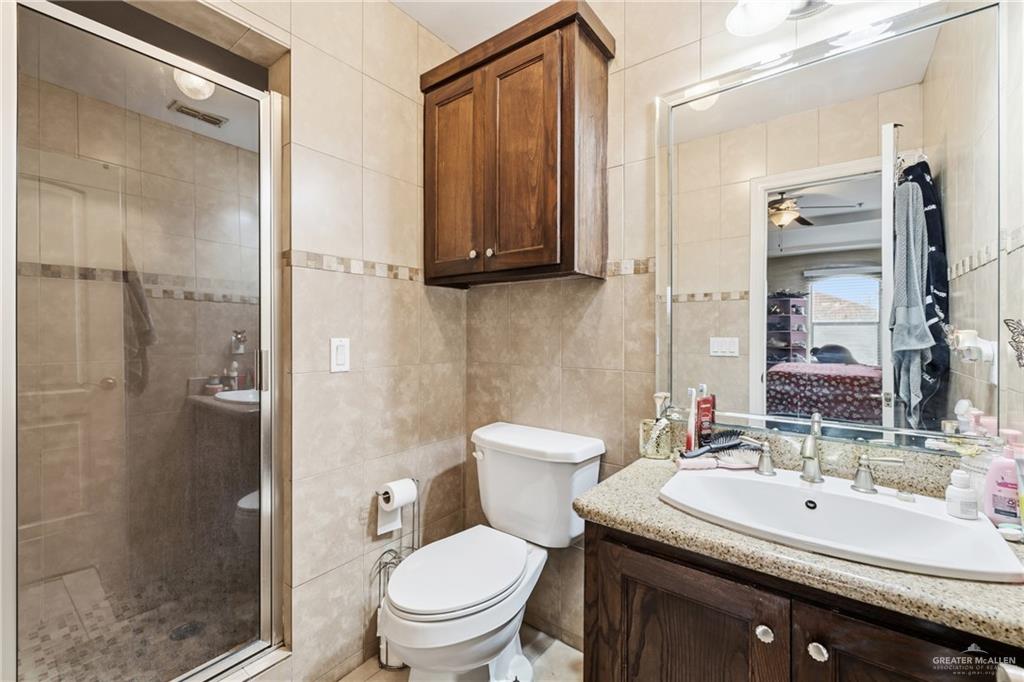 3005 South L Street, Unit 3 McAllen, TX 78503 - Photo 13 of 14 a bathroom with a sink toilet and shower