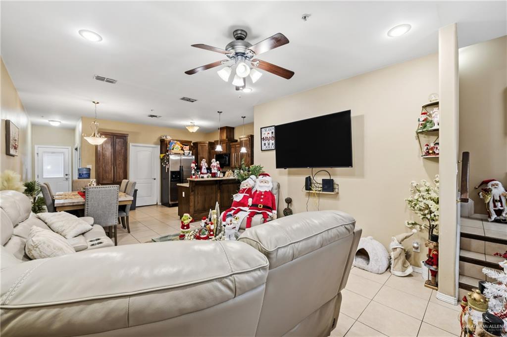3005 South L Street, Unit 3 McAllen, TX 78503 - Photo 2 of 14 a living room with furniture and a flat screen tv