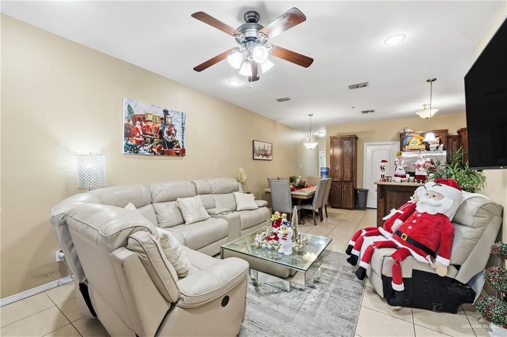 3005 South L Street, Unit 3 McAllen, TX 78503 - Photo 3 of 14 a living room with furniture and a flat screen tv