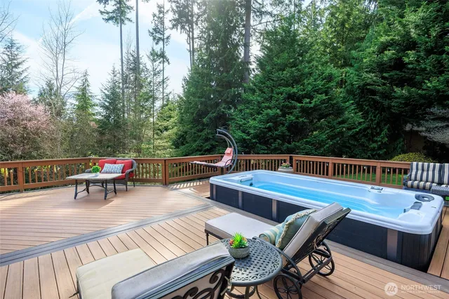 a view of a chairs and table on the deck