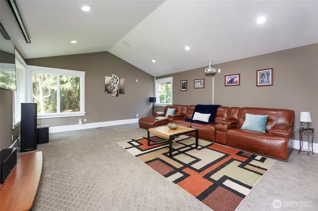 a living room with furniture rug and window