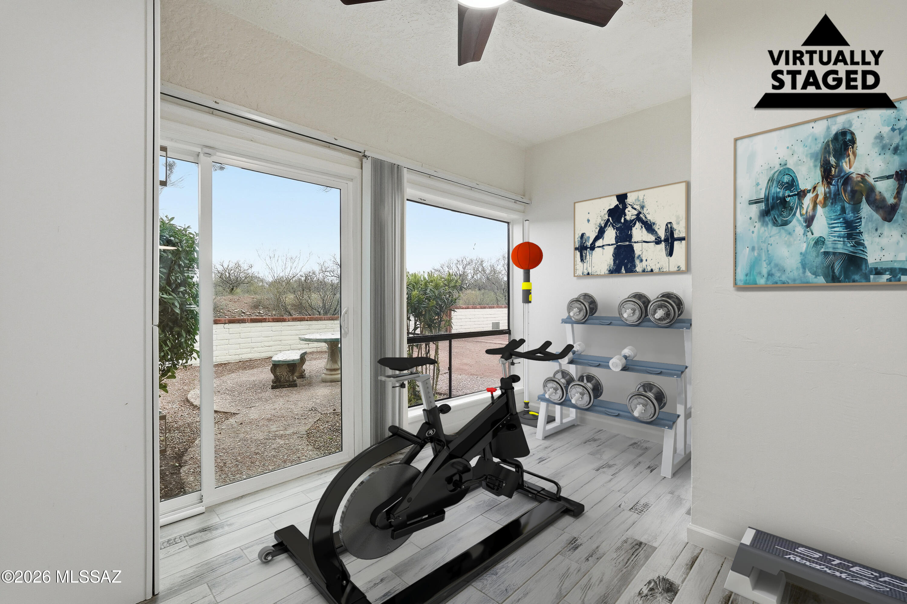 1183 Circulo Canario Rio Rico, AZ 85648 - Photo 29 of 31 a room with gym equipment and a large window