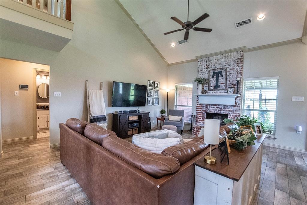 10336 Jennifer Circle Forney, TX 75126 - Photo 5 of 37 This design evokes an open-concept space that prioritizes natural light, soaring ceilings, and a seamless connection between the entry and living areas.