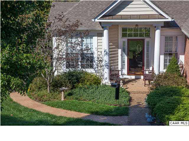 2127 Shepherds Ridge Road Charlottesville, VA 22901 - Photo 3 of 13 a black and white house with a yard plants and large tree