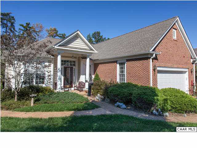 2127 Shepherds Ridge Road Charlottesville, VA 22901 - Photo 6 of 13 a view of a house with brick walls and a yard with plants