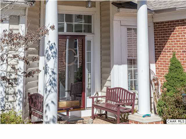 2127 Shepherds Ridge Road Charlottesville, VA 22901 - Photo 7 of 13 a view of a brick house with a bench and floor to ceiling window