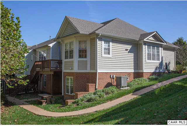 2127 Shepherds Ridge Road Charlottesville, VA 22901 - Photo 8 of 13 a view of a house with a small yard and potted plants