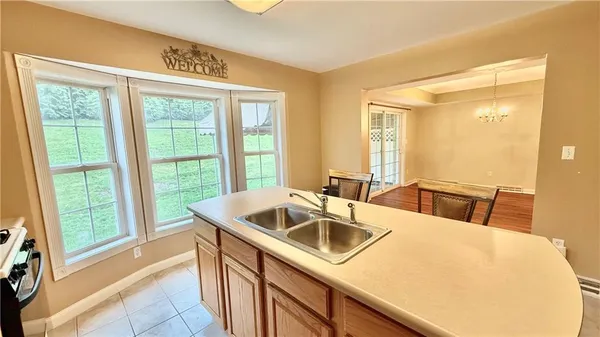 a kitchen with a sink and a window