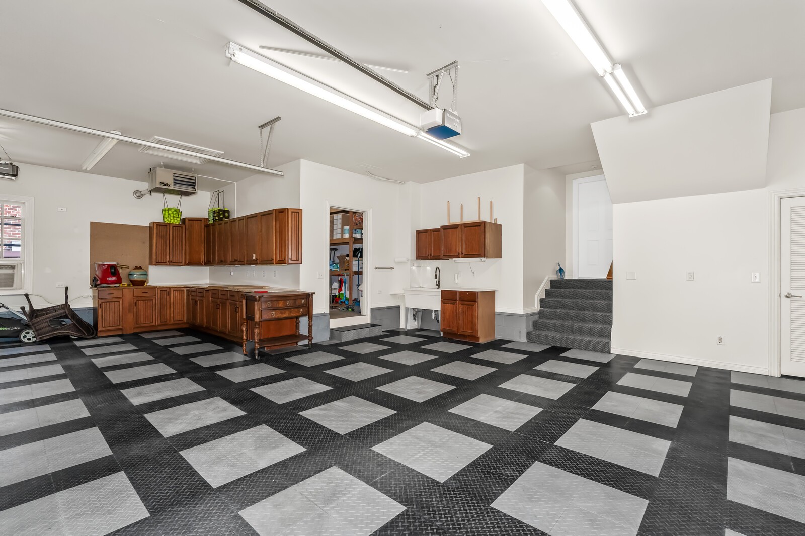 116 Addison Avenue Franklin, TN 37064 - Photo 46 of 63 3 car garage with RaceDeck flooring, shop, storage room and storage closet