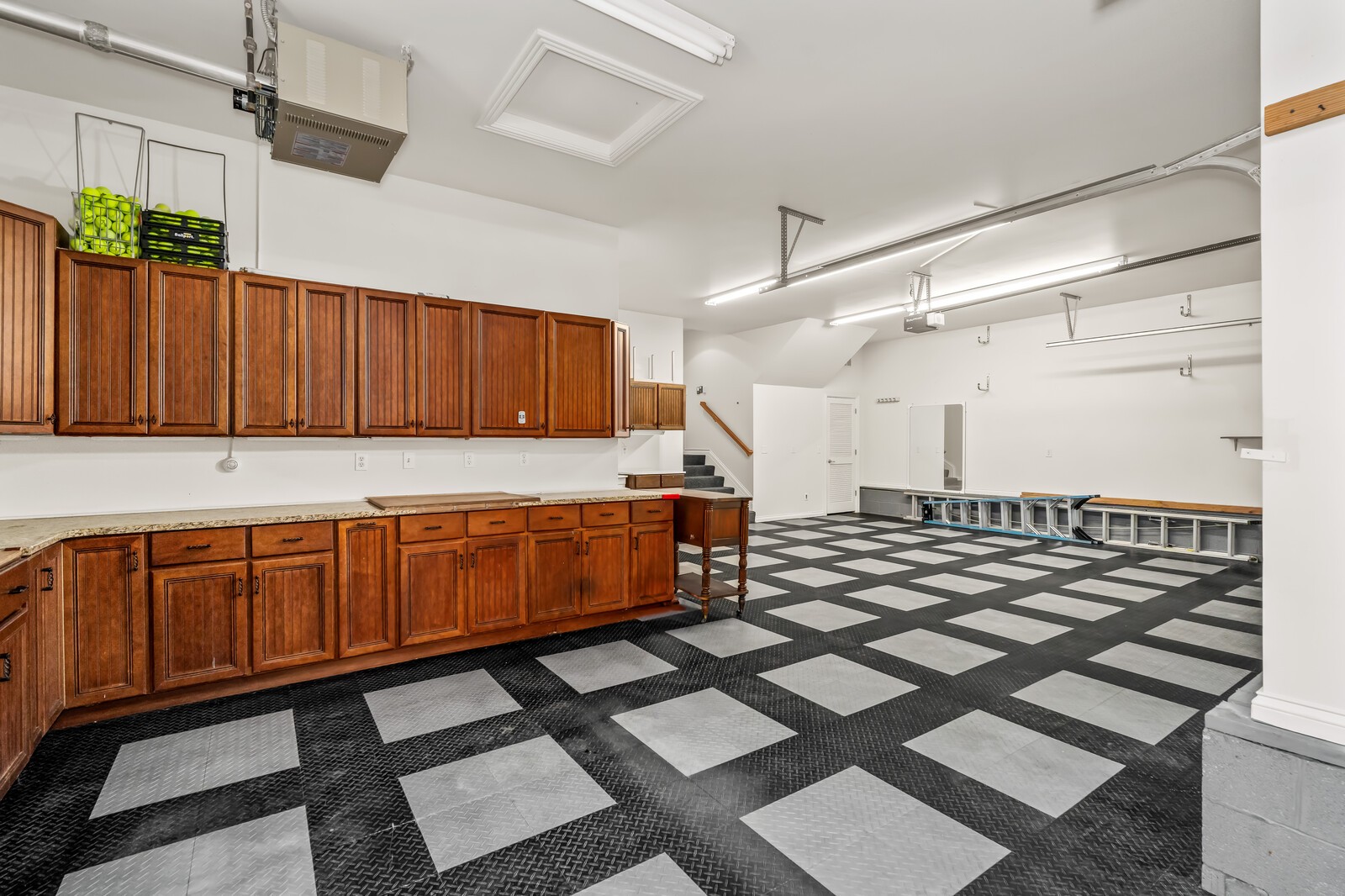 116 Addison Avenue Franklin, TN 37064 - Photo 47 of 63 3 car garage with RaceDeck flooring, shop, storage room and storage closet