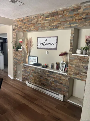 a view of a refrigerator with wooden floor