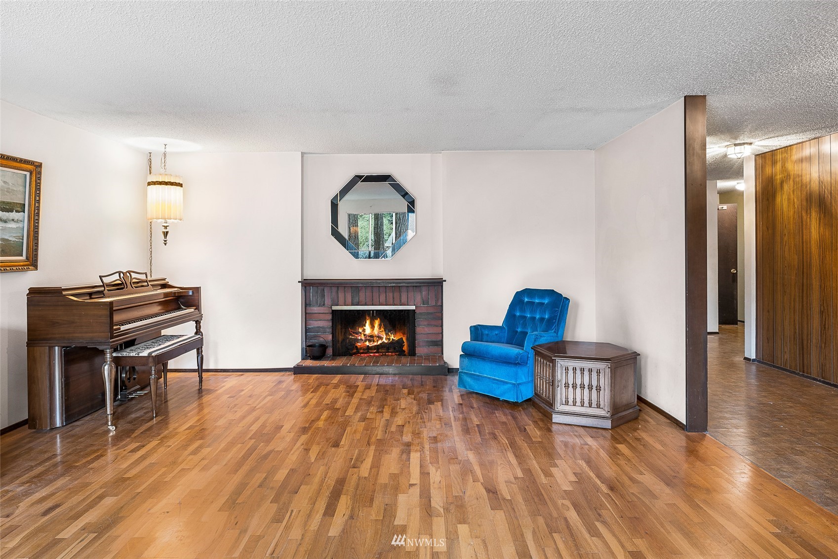 14332 118th Avenue Northeast Kirkland, WA 98034 - Photo 13 of 40 a living room with furniture and a fireplace