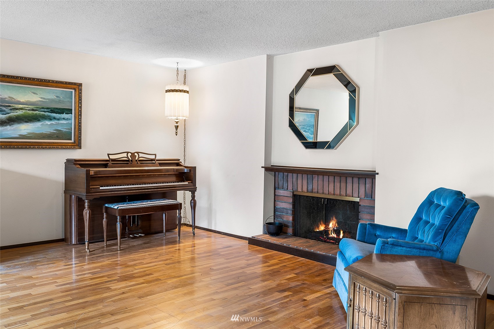 14332 118th Avenue Northeast Kirkland, WA 98034 - Photo 14 of 40 a living room with furniture and a fireplace