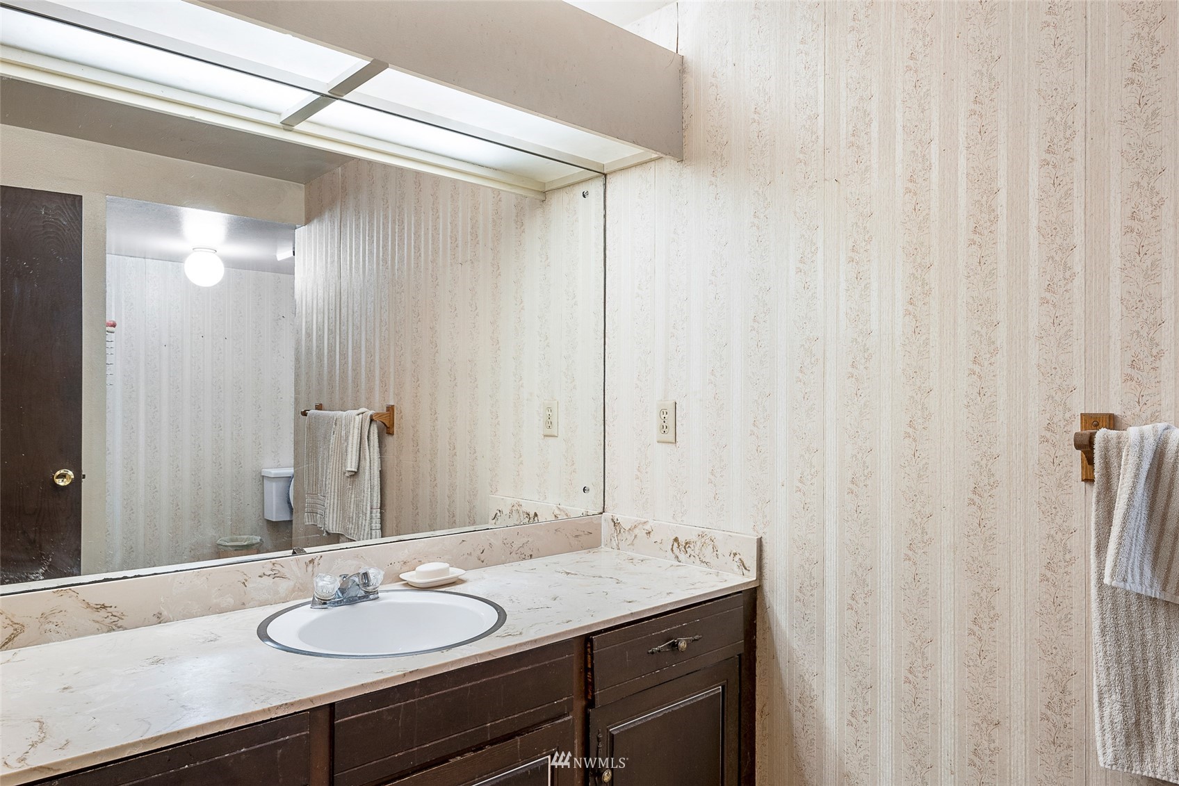 14332 118th Avenue Northeast Kirkland, WA 98034 - Photo 16 of 40 a bathroom with a sink and a mirror
