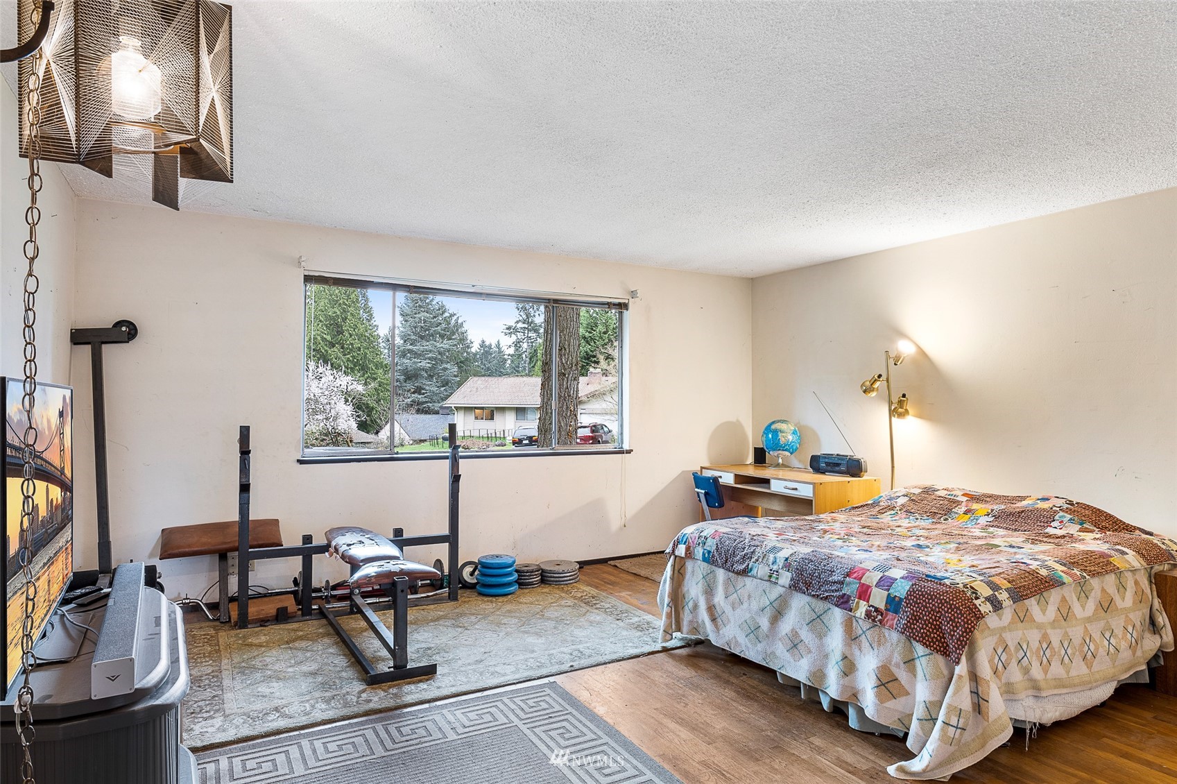 14332 118th Avenue Northeast Kirkland, WA 98034 - Photo 17 of 40 a bedroom with a bed and large windows