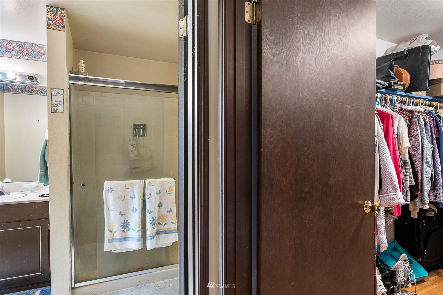 14332 118th Avenue Northeast Kirkland, WA 98034 - Photo 20 of 40 a view of walk in closet with clothes and shoes