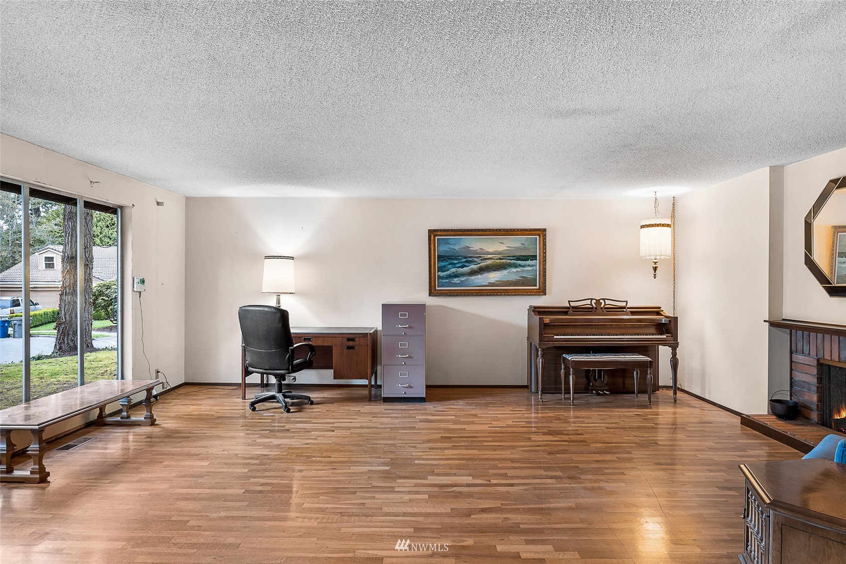14332 118th Avenue Northeast Kirkland, WA 98034 - Photo 2 of 40 a view of a workspace with furniture and a window