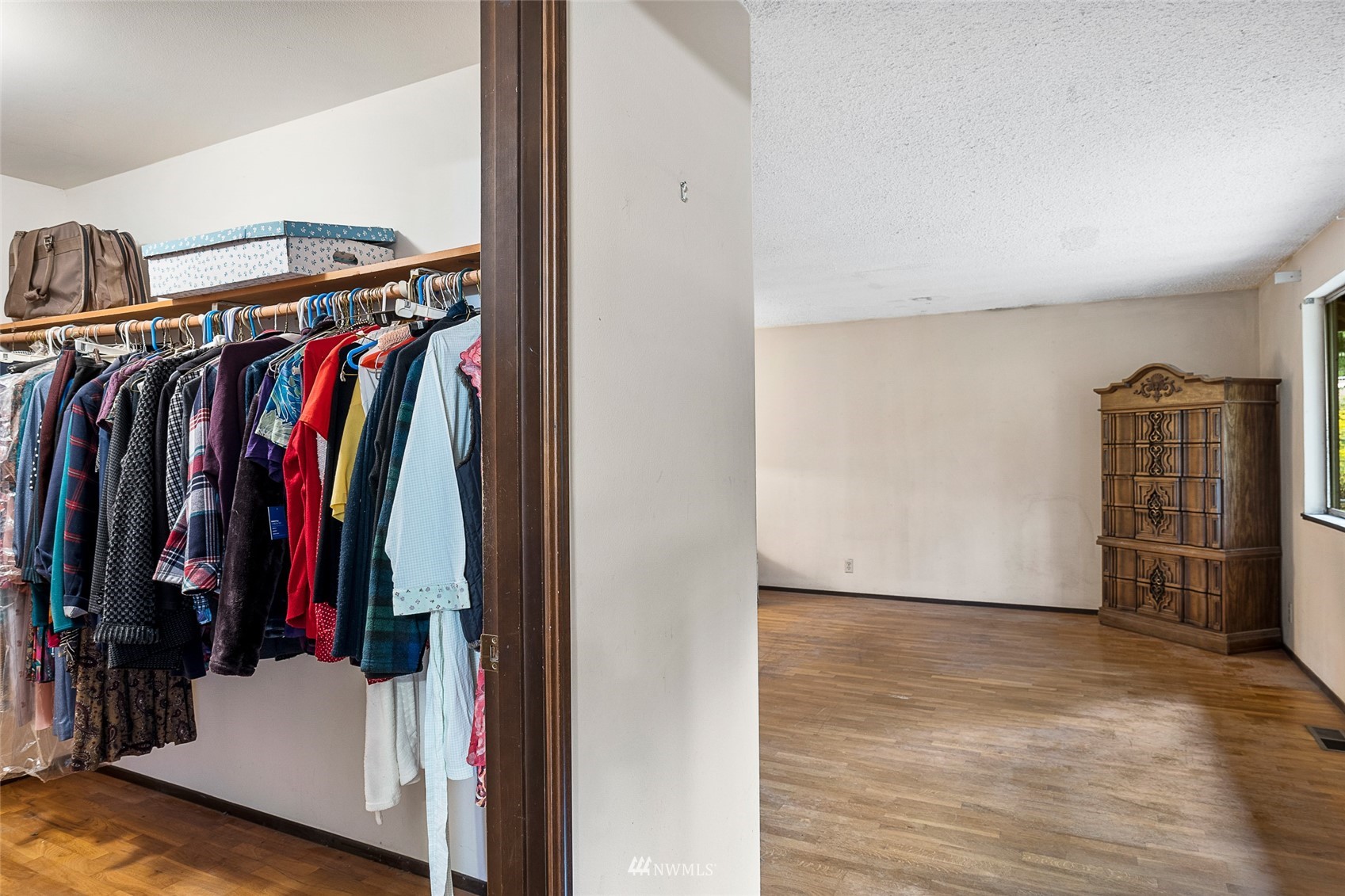 14332 118th Avenue Northeast Kirkland, WA 98034 - Photo 21 of 40 a view of walk in closet with clothes and shoes