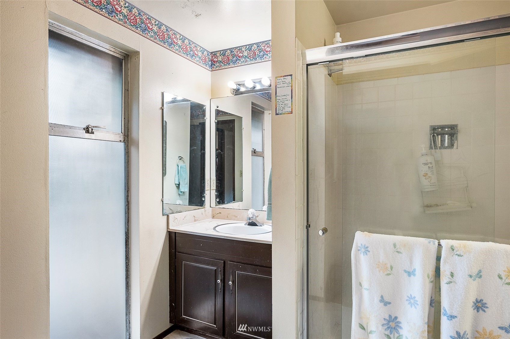 14332 118th Avenue Northeast Kirkland, WA 98034 - Photo 22 of 40 a bathroom with a shower sink and mirror
