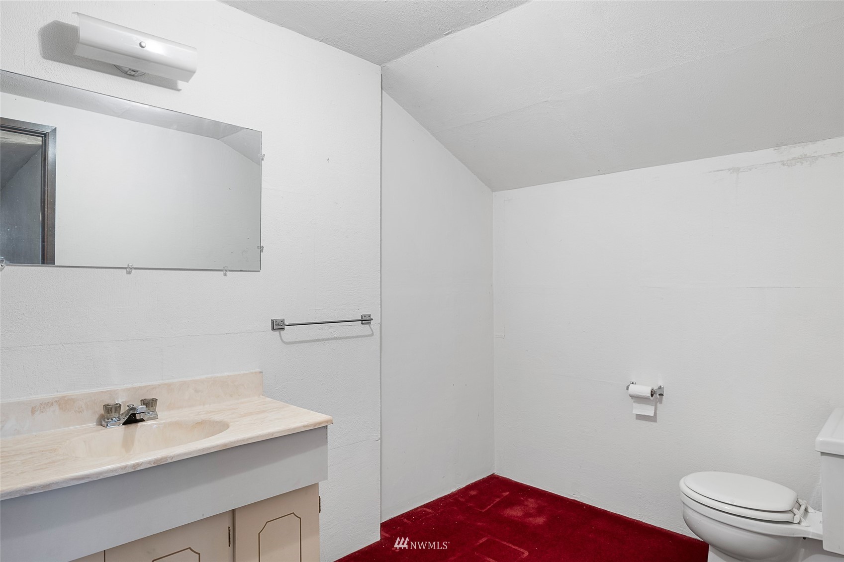 14332 118th Avenue Northeast Kirkland, WA 98034 - Photo 32 of 40 a bathroom with a sink a toilet and a mirror