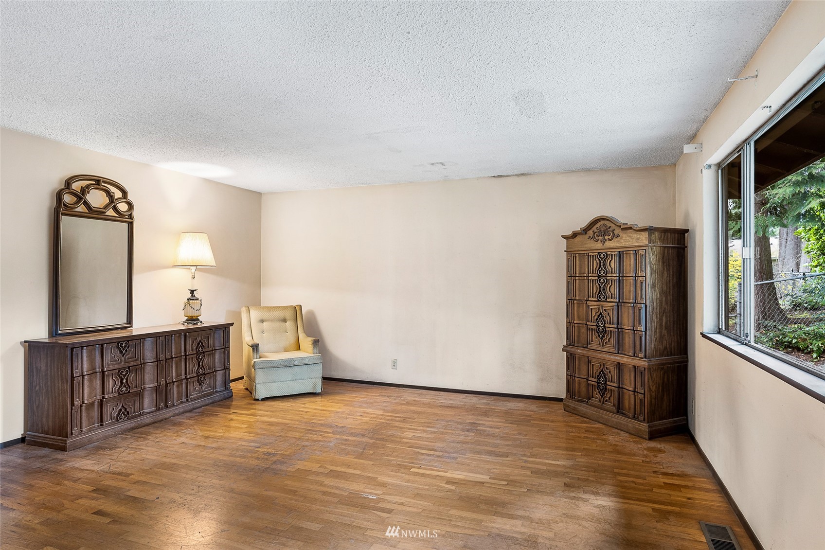 14332 118th Avenue Northeast Kirkland, WA 98034 - Photo 5 of 40 wooden floor in an empty room with a window