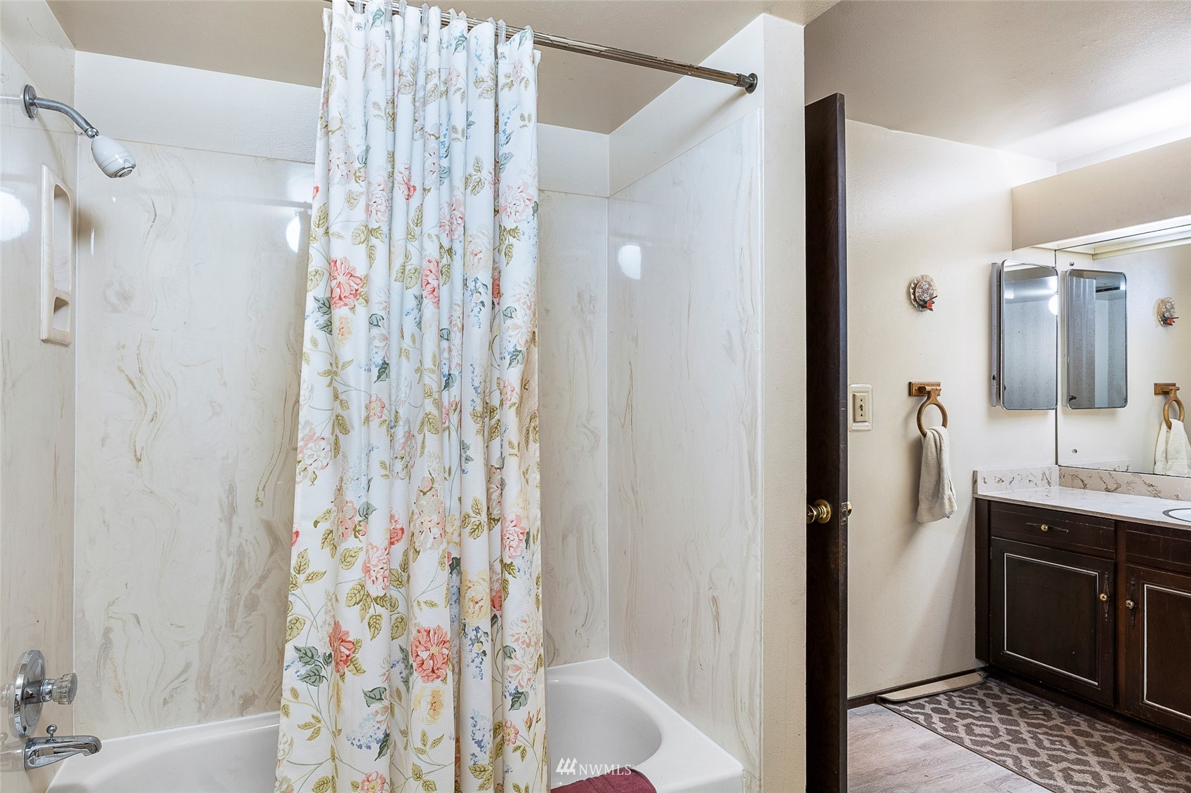 14332 118th Avenue Northeast Kirkland, WA 98034 - Photo 7 of 40 a bathroom with a shower and a sink