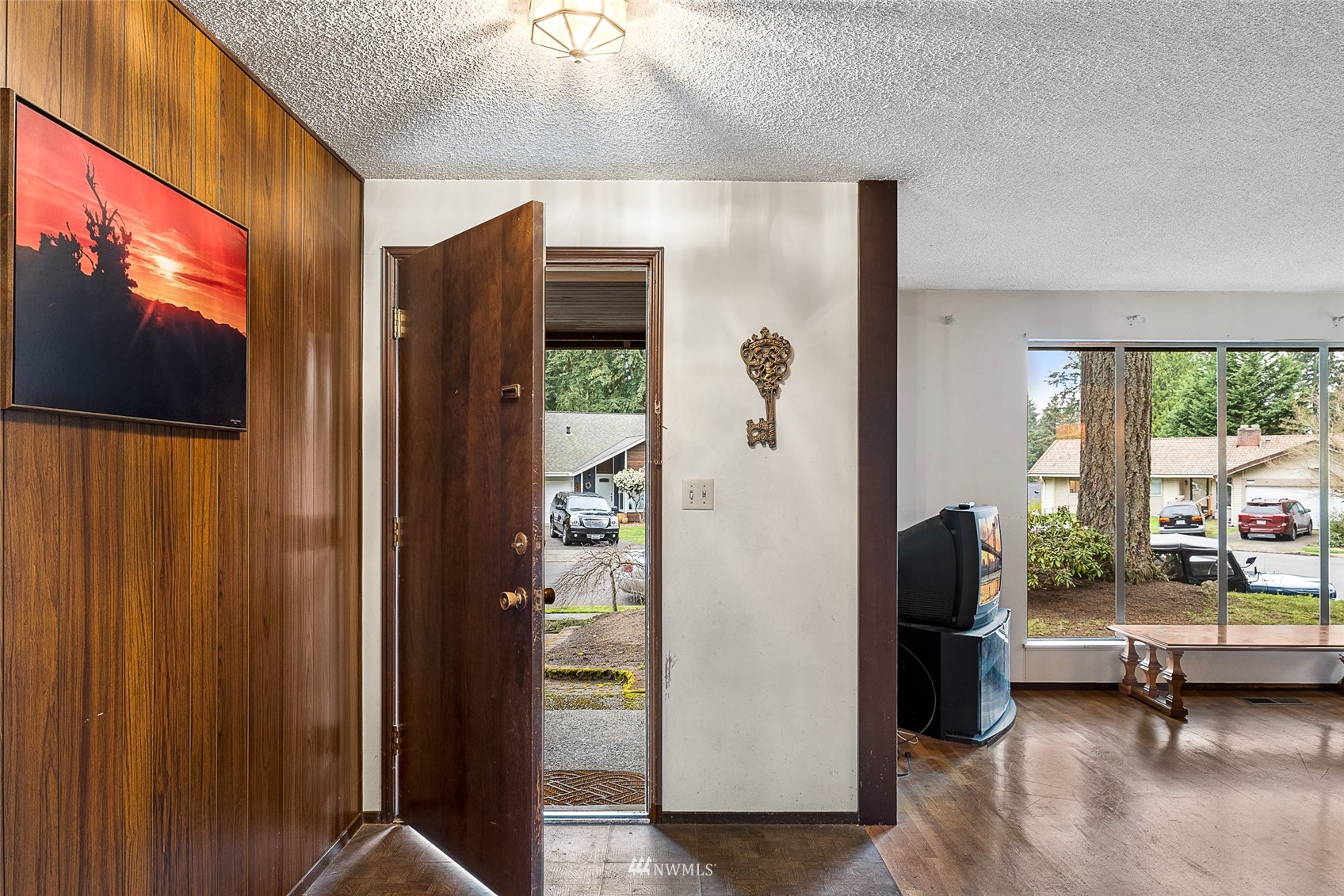 14332 118th Avenue Northeast Kirkland, WA 98034 - Photo 10 of 40 a living room with furniture a flat screen tv and floor to ceiling window