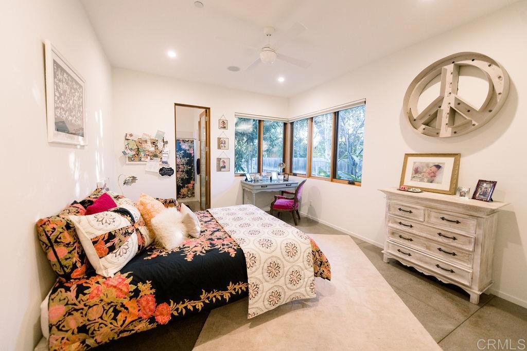 1866 Sheridan Road Encinitas, CA 92024 - Photo 12 of 25 a bed room with a bed and a painting on the wall