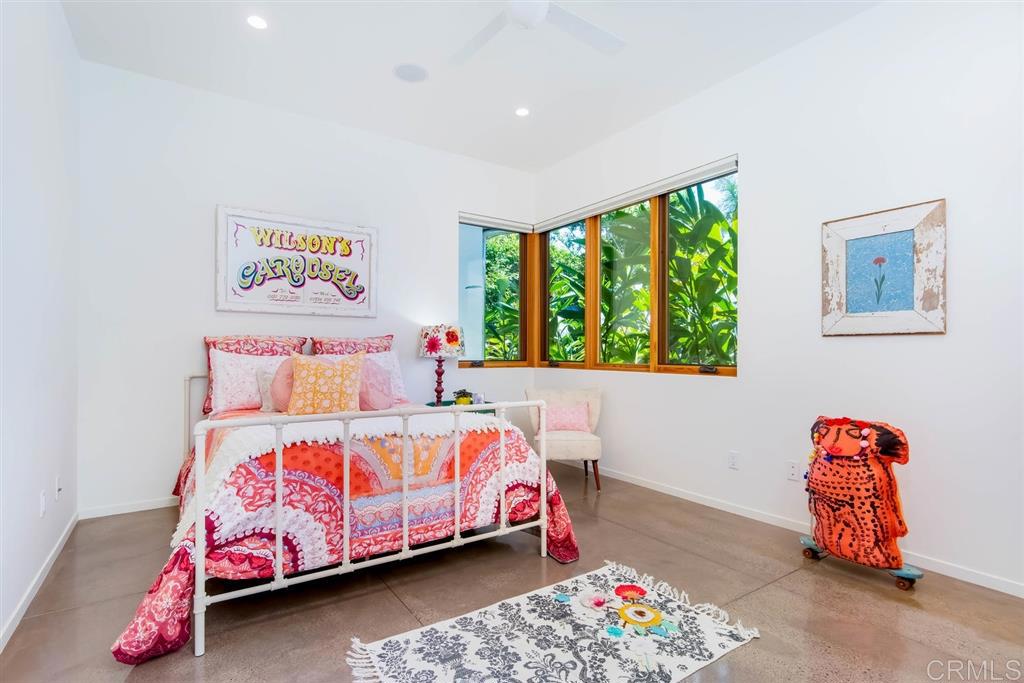 1866 Sheridan Road Encinitas, CA 92024 - Photo 13 of 25 a bedroom with a bed and a window